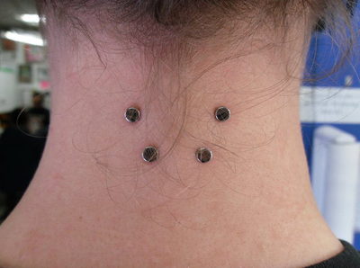 surface piercing nape of neck Infusion Studio